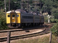 A RDC train zips around Birch Cove, and is now about to round Sherwood Point.