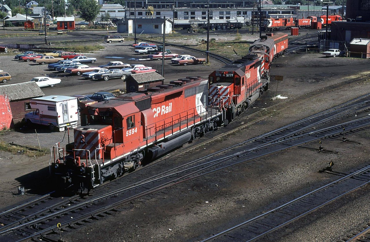 An interesting array of power - Sd-40's an high nose GP-9 and a couple covered wagons - comes out of the servicing bay at Alyth Shops.