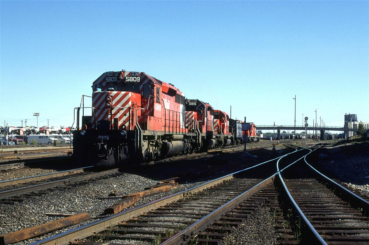 This power set is likely to go on a westbound unit train, either in Alyth Yard or out west of town in Kieth Yard. The Robot car will control the trailing engine after being put 2/3 into the train.
The track veering to the right is the MacLeod sub..