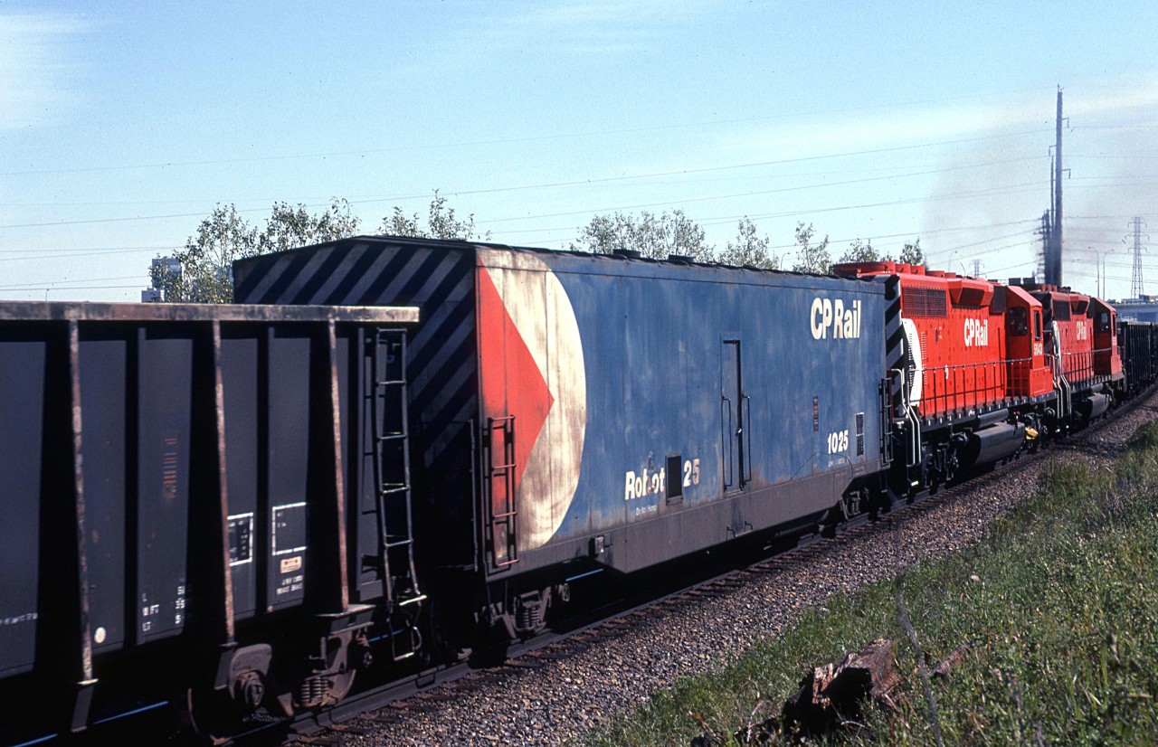 OK, no one is going to call this the greatest train picture in the world, but it does show a Robot car, fairly well.
It is placed about 2/3 into this westbound sulphur train.