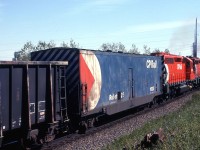 OK, no one is going to call this the greatest train picture in the world, but it does show a Robot car, fairly well.
It is placed about 2/3 into this westbound sulphur train. 