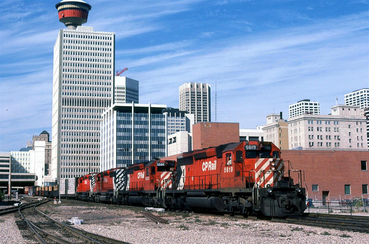 An eastbound manifest train pulls through downtown Calgary.