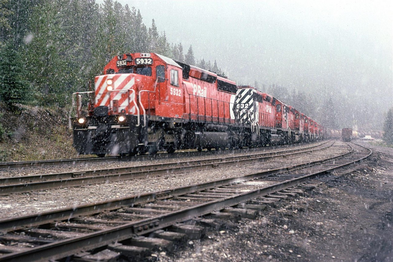 8 or 9 locomotives have this westbound grain train in check as it descends Kicking Horse pass between the two Spiral Tunnels.
