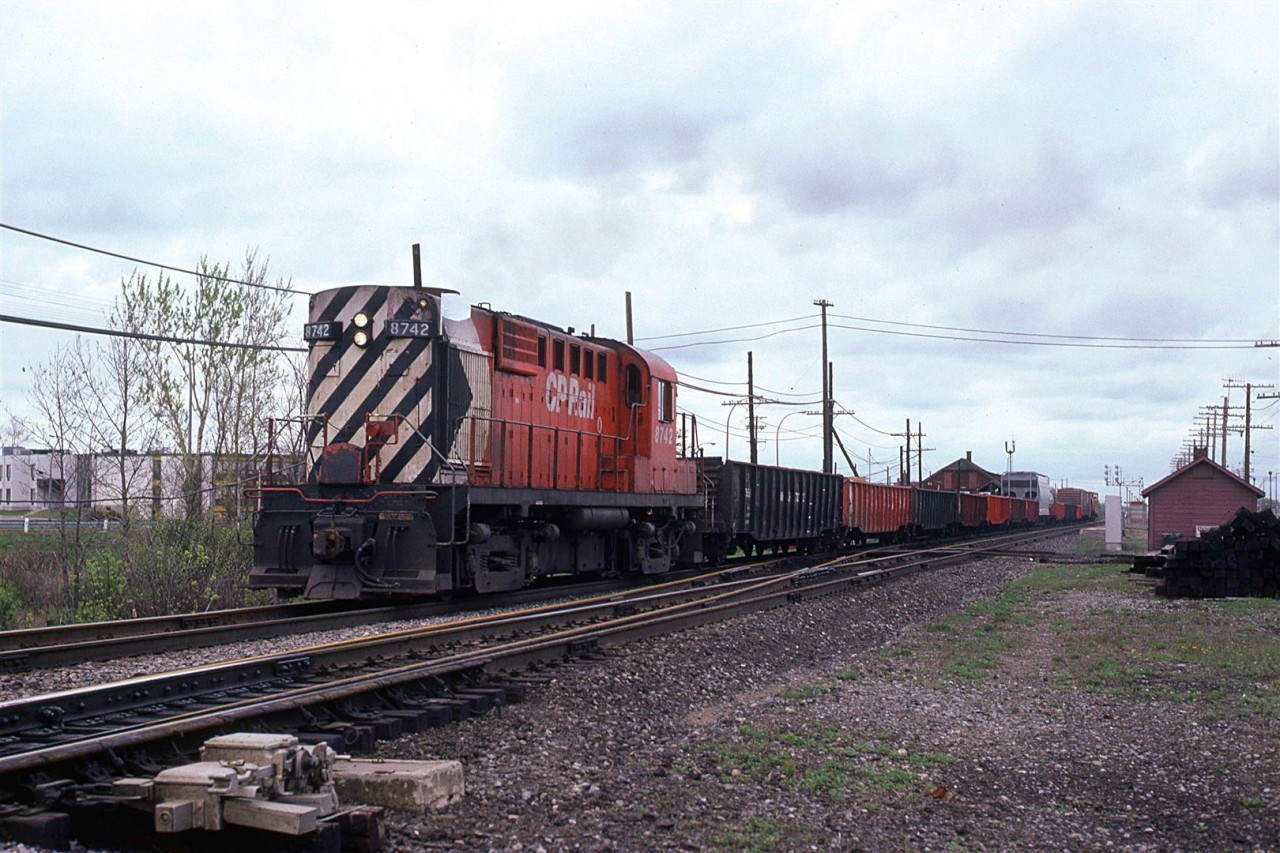 This short westbound local came by next. It is passing in front of the CP Dorval station.