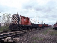 This short westbound local came by next. It is passing in front of the CP Dorval station.