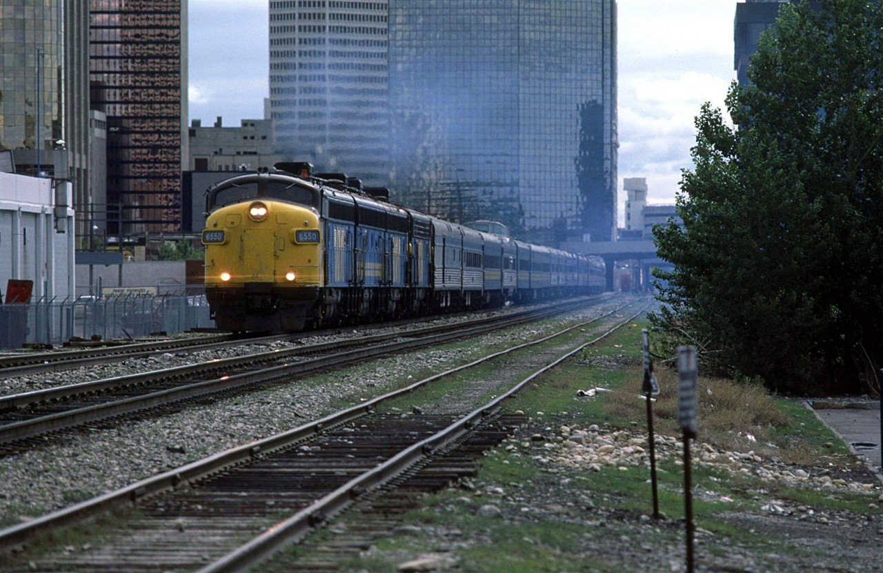The westbound "Canadian" accelerates out of the Calgary station, with the Gulf Canada Square in the background.
Four engines and 20 plus cars.