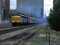 The westbound "Canadian" accelerates out of the Calgary station, with the Gulf Canada Square in the background.
Four engines and 20 plus cars.