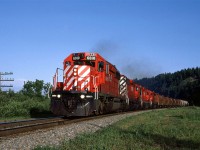 CP 6010 lead a grain train west through Edworthy Park on the west side of Calgary. It may look rural, but, even in '83, it is well within the urban limits of Calgary.