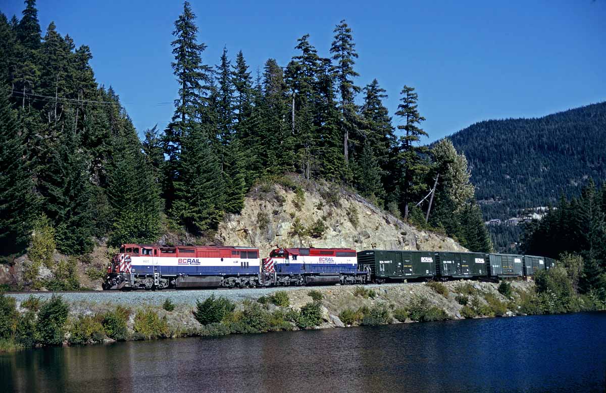 BR Rail southbound freight passing the small lake just south of Whistler, BC on a hot but clear day in August 1998