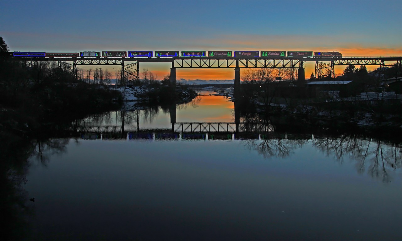With this year's Holiday Train season rapidly approaching I thought it an appropriate time to share a few shots from the past couple of years, as it appears I probably will not be venturing out to take any this year. This first shot shows the 2013 CP Canadian Holiday Train creeping over the Seguin River in Parry Sound minutes before stopping for its performance at the station.