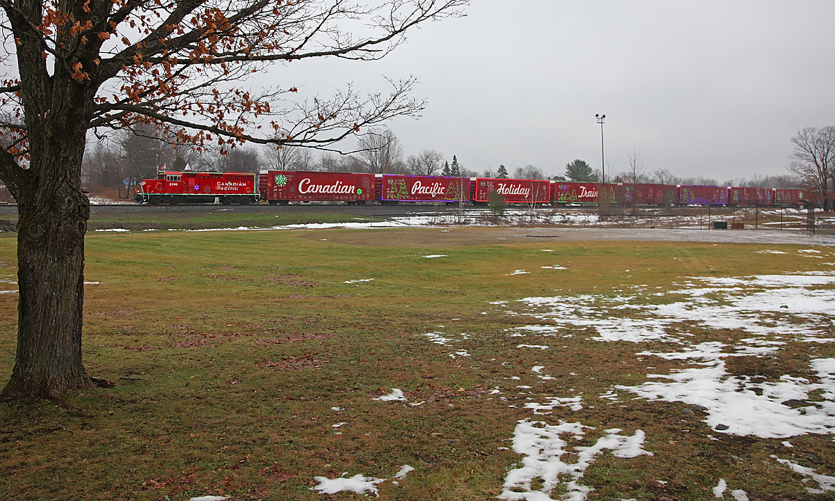 The 2014 CP Holiday Train stops in MacTier for its performance on a soggy and grey November afternoon. Mild temperatures and rain have removed almost all of the near 4' of snow that had been on the ground contributing to the Christmas atmosphere just a few days previously, much to my disappointment.
