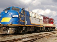 OSRX 1401 - OSRX 1620 pause briefly in the yard at Woodstock, as they wait for a switch to be lined to grab another cut of cars