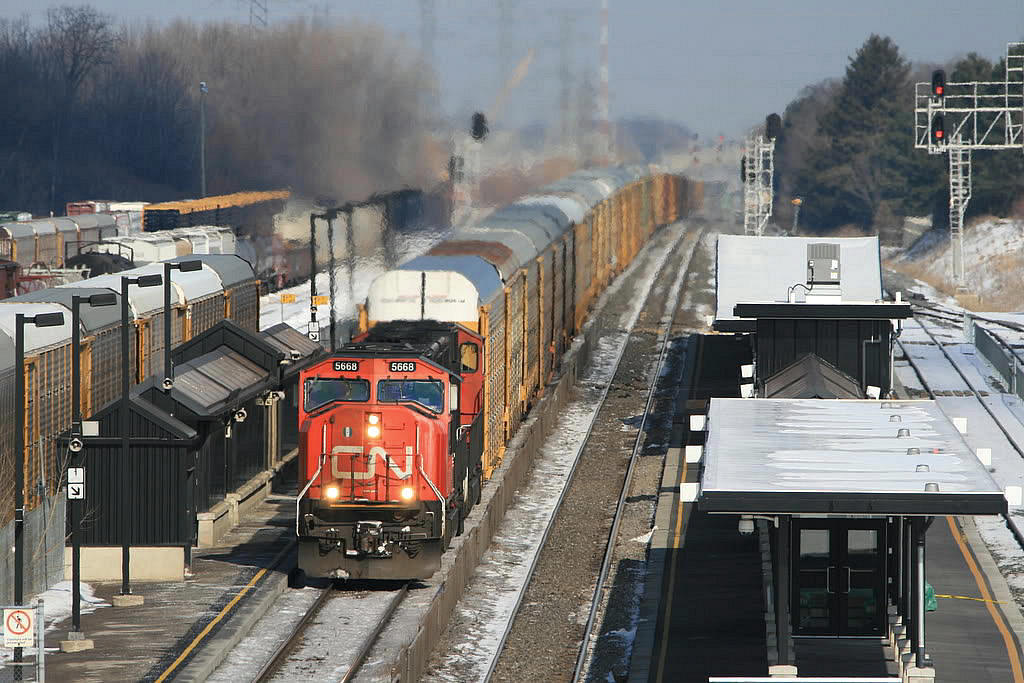 A solid 95 loaded multilevels from GM Oshawa rips west past the Aldershot VIA/GO station...it wasn't much longer that the two daily WB solid auto trains lasted out of Oshawa, these 10,000 foot trains were nice.