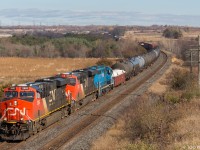 CN 305 comes through Newtonville on a wonderful Fall afternoon, with a special unit trailing third. A blue GP40, LLPX 2269, trails third behind a pair of GEVOs. (1:51pm) (CN2892, CN2870, LLPX2269, DPU CN2866)