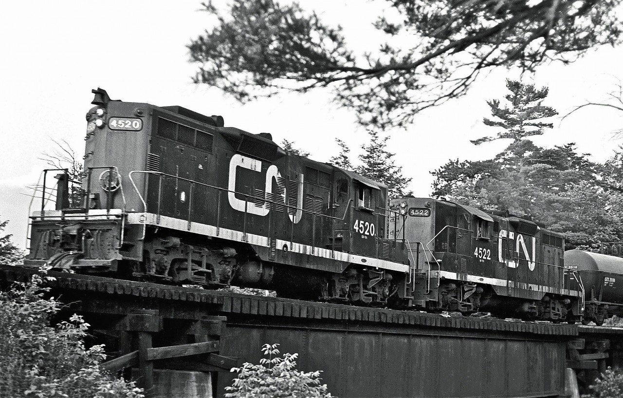 Built in 1956, a couple of EMD GP9s are seen working their way through Toronto’s Don Valley.  

 
Locomotive #4520 would be rebuilt in 1993 as Slug 278.
