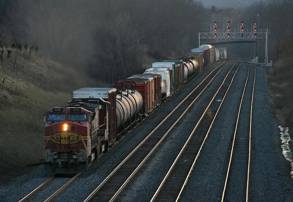 A great way to round out a day....a pair of BNSF (Santa Fe lettered) B40's pull an eastbound CN freight down the new track 3 east of Snake