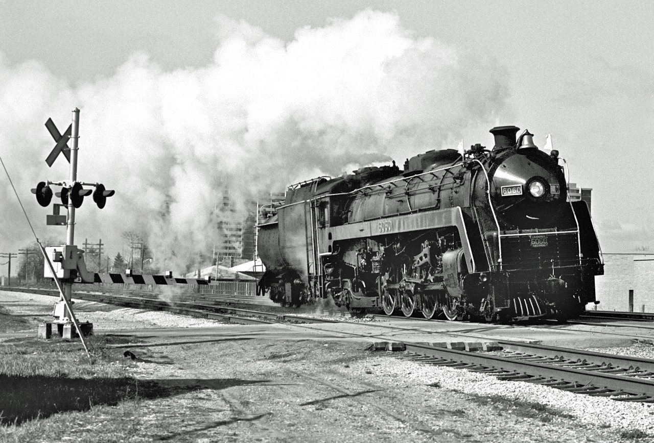 It looks like the Mountain-type has a smile on her face as she sprints away from Toronto!


Check out Steve Danko’s great colour shot and narrative of this event…


http://www.railpictures.ca/?attachment_id=14218


(I was fairly certain that this image was taken around Brimley Road in Scarborough.  The current satellite image, however, doesn't quite match.  My apologies if I missed the mark).