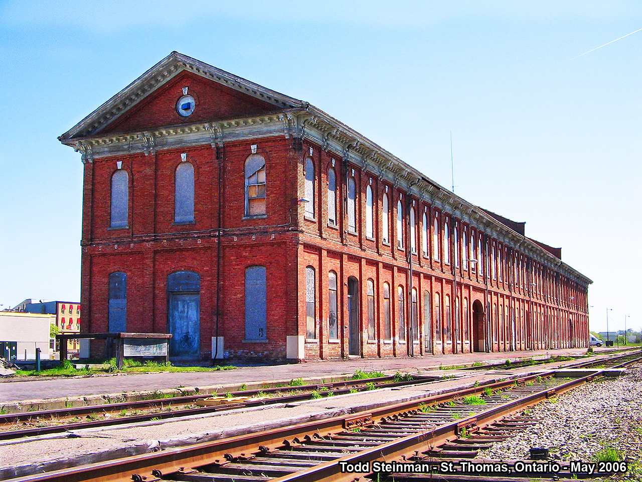 THE GRAND OLD LADY!  When the Michigan Central Railway completed it's line through Southwestern Ontario between Windsor and Fort Erie (the Canada Southern), it built it's finest and largest structure at St. Thomas. Complete with an extensive yard and railway shop, it housed the HQ for the railway as well as being the largest station located in Ontario. From Elizabeth Wilmot's book "When Any Time Was Train Time", she wrote that the St. Thomas station's entire length took up a whole city block! There is definately no other station like it. 
Eventually, the decline and unsteady ownership of the Canada Southern led to it's demise, and after owners such as the New York Central, which became Penn Central - then Conrail to CP and finally CN, the station lost some of it's architectural features and eventually was boarded up for good.  Not the same outcome for the former railway shops, as they now house the Elgin County Railway Museum. 
But all was not lost for the station. A group came forward with a plan to restore the station. Slowly though the last few years, the station received a new roof, and work began restoring the interior to it's former glory. Today the station can be used as a banquet hall, as work still continues to have it fully restored. Sadly, the remaining rail was torn out only a few years ago. The Canada Southern is no more, except fro the few feet of steel that remain in front of the station and run over to the museum. 
The museum is well worth the visit with it's various rolling stock, artifacts, signage, etc. The station is still photo-worthy, while majority of the former roadbed is now a trail for bikers and those who enjoy a good walk.