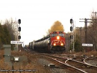Lead engine CN 2277 leads this very log freight over the grade, slowly passing the signals and name signs marking where the old Grafton station once stood. This train carried a surprise with another CN unit mid-train. I had never seen this arrangement before...but was very happy to be ending my day on a high note.