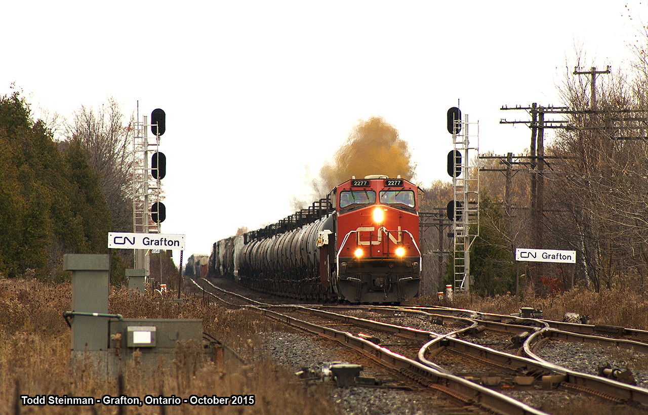 Lead engine CN 2277 leads this very log freight over the grade, slowly passing the signals and name signs marking where the old Grafton station once stood. This train carried a surprise with another CN unit mid-train. I had never seen this arrangement before...but was very happy to be ending my day on a high note.
