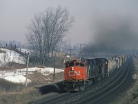 A trio of MLWs on #393 was not unusual in 1987 but an M420W leading was different. CN 2544 is smoking it up with #393 with a pair of six-axle MLWs trailing as they approach Brantford. 