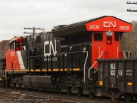 <b> STUCK IN THE MIDDLE! </b> This was the first surprise of my day while at the Station Road crossing in Grafton. CN 3030 is found in the midst of train 305. This is the first train in my 30+ years of railfanning on the Kingston Subdivision that I saw this arrangement, although as fellow rp.ca user 'mberry' pointed out - this is common. To see CN 305 approach Grafton: <a href="http://www.railpictures.ca/?attachment_id=21409">http://www.railpictures.ca/?attachment_id=21409 </a>

