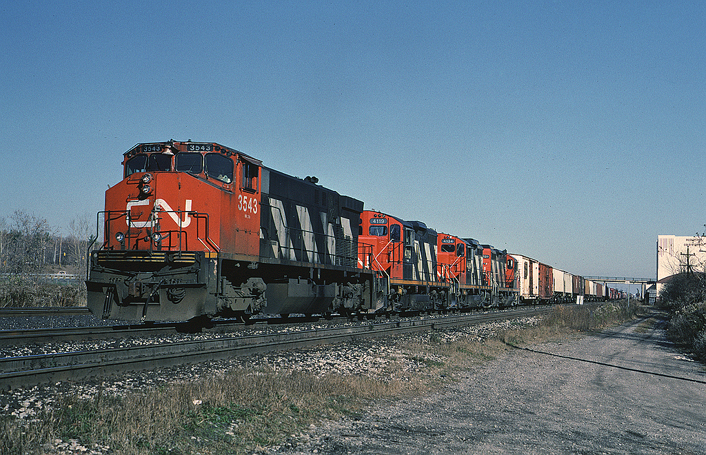 This was likely the last time I saw an MLW M420W leading a train. CNR 3543 leads a trio of GP9RMs with Toronto - Niagara Falls train #449 which could usually be counted on the show up in Burlington mid-morning.