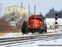 Dimunitive CN 7025 rolls in from Brantford onto what used to be the Harrisburg Subdivision - but is now the north siding at Paris Junction. Paris Junction was once a busy place, and by today's standards of railroading it still is. But industries have closed - the buildings in the background...some were old facilities for Paris Kitchens, and the remaining buildings were once used for manufacturing businesses that would ship their product by rail. However, on this cold wintry day in January, it was just as cold for photography. Not too much action aside from little old 7025 coming to assemble some of it's manifest and haul it back to the Brantford yard.