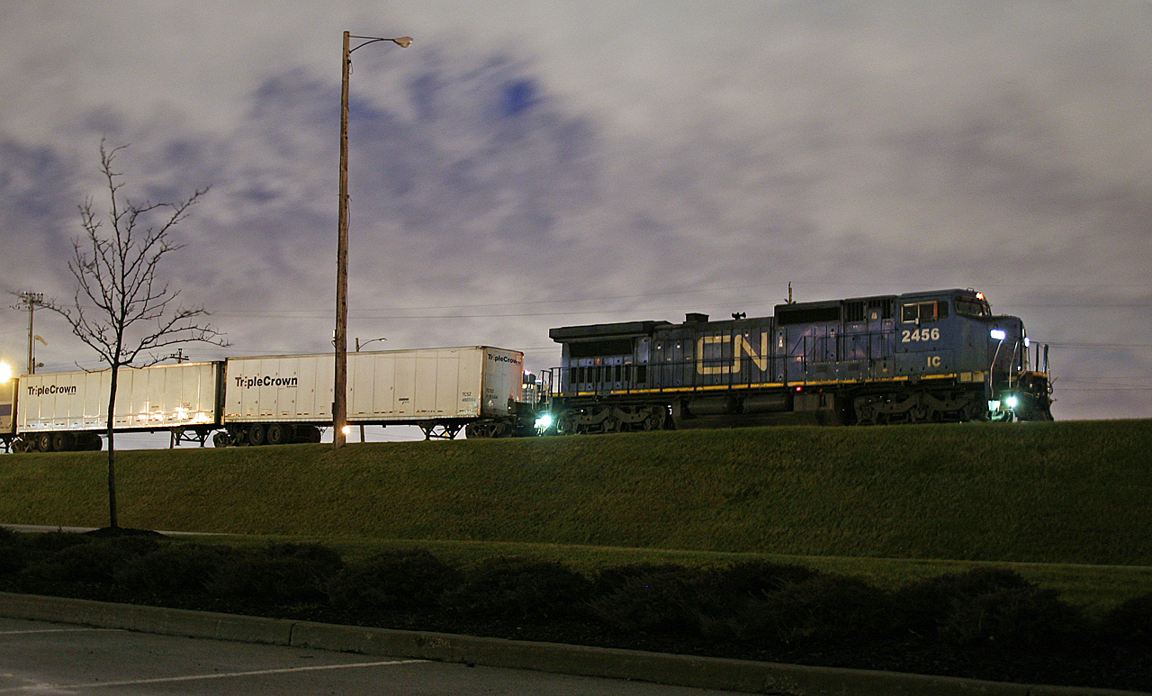 The end of an era.  The last eastbound Triple Crown Roadrailer arrived Mac Yard at 0605 on November 19th.  Service had been winding down over the last few weeks with only a handful of trains operating, after being a 6 day a week service with trains up to 120 cars in length.  Typically an overnight run, it was always a treat catch this train operating late, making for a daylight run across Southern Ontario.  I decided to wake up early on the 19th and head into work with the hopes that the final train was operating late.  After a few eastbounds pulled into the yard, IC 2456 rolled to a stop with the last Q 144 in tow.  Here we see Q 14461 18 sitting on the Halton Inbound, waiting for M 39891 18 to finish yarding their train, before pulling into Conport for the last time with 29 trailers in tow.   The final westbound Triple Crown Roadrailer is expected to operate before the end of the month, completeing the pull out of Triple Crown operations from Canada.