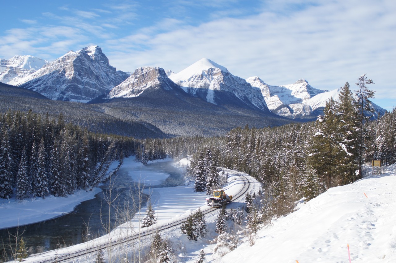 KSF940 snow fighter CP 5711-61 rounds Morant's Curve on this beautiful but very cold November morning. Mainline plowing, switch cleaning and backtrack clearing is the order of the day for this brand new addition to CP's snow clearing fleet.