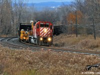 At the midway point of the chase, eastbound CWR train passes Lovekin Siding with CP 5968 as sole power on the diminutive train. 1449hrs.