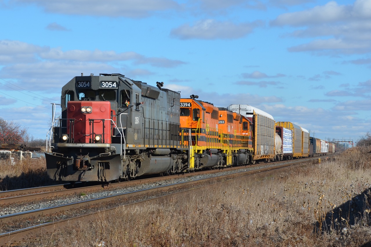 With an Ex SP in the lead, a trio of EMD units power a short but fast GEXR 431 a few minutes in head of CN A435.