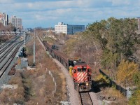 <b> That will do pig, that will do.. </b> With a few minutes to spare to set up for the shot, a lone SD40-2 leads a loaded continuous welded rail train southwards towards West Toronto in perfect light. Special thanks to Eric Portelli for the heads up. 