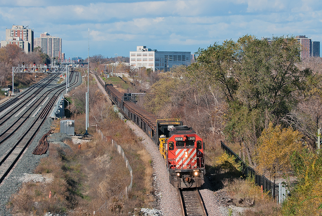 That will do pig, that will do..  With a few minutes to spare to set up for the shot, a lone SD40-2 leads a loaded continuous welded rail train southwards towards West Toronto in perfect light. Special thanks to Eric Portelli for the heads up.