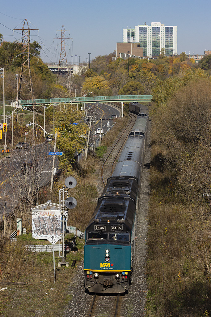The Canadian snakes through Don Valley after a long trip across Canada from Vancouver. As it's arriving to Toronto on the Bala, the train rolls alongside Bayview Ave and the abandoned Don Branch now covered in grass.