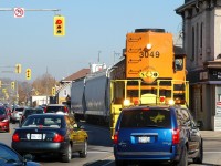 RLHH 3049 shoving 3 hopper cars back towards the Dundas Sub amongst heavy traffic