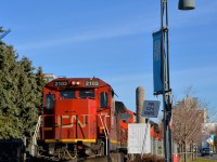 <b>CN ends.</b> The sign beside CN 2103 says 'CN ends' in French and English, as this is where the CN Wharf Spur ends and the Port of Montreal's tracks begin. CN 2103 is leading CN 149 which is just inches away from being on CN tracks. It will leave in about 20 minutes, on its way to Chicago with high priority intermodal from the harbour.