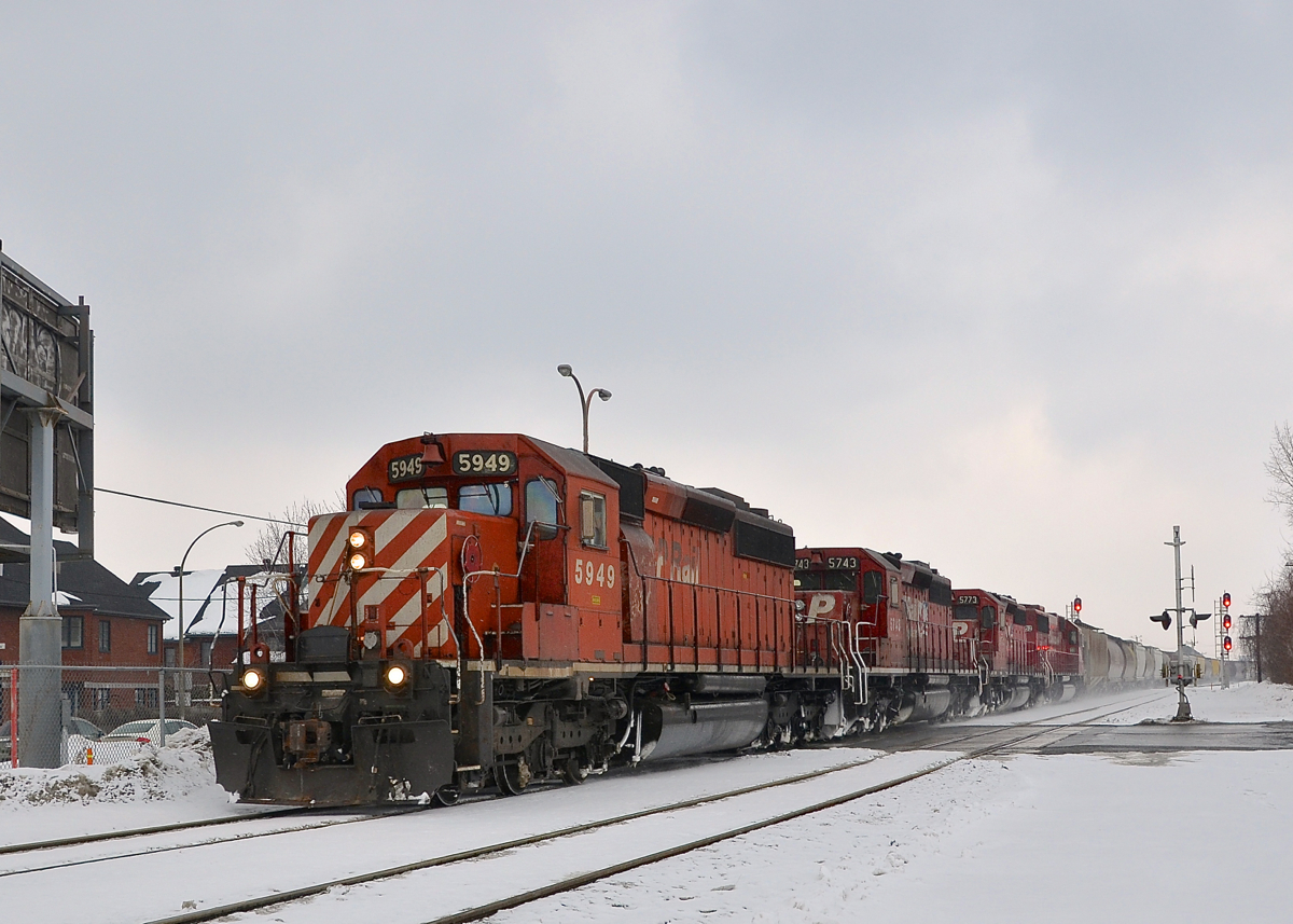 Old school grain train power. An empty grain train from Quebec City with three CP SD40-2's and an ex-SOO SD60 (CP 5949, CP 5743, CP 5773 & CP 6252) are nearly at the end of their run as they approach St-Luc yard in Montreal last winter. While the train has CP power and is on CP trackage here, it is a Quebec-Gatineau train and crew. Quite a number of grain trains run from Montreal to Quebec City every winter along this route, and the power is all-EMD as heavier GE's are not permitted on the route.