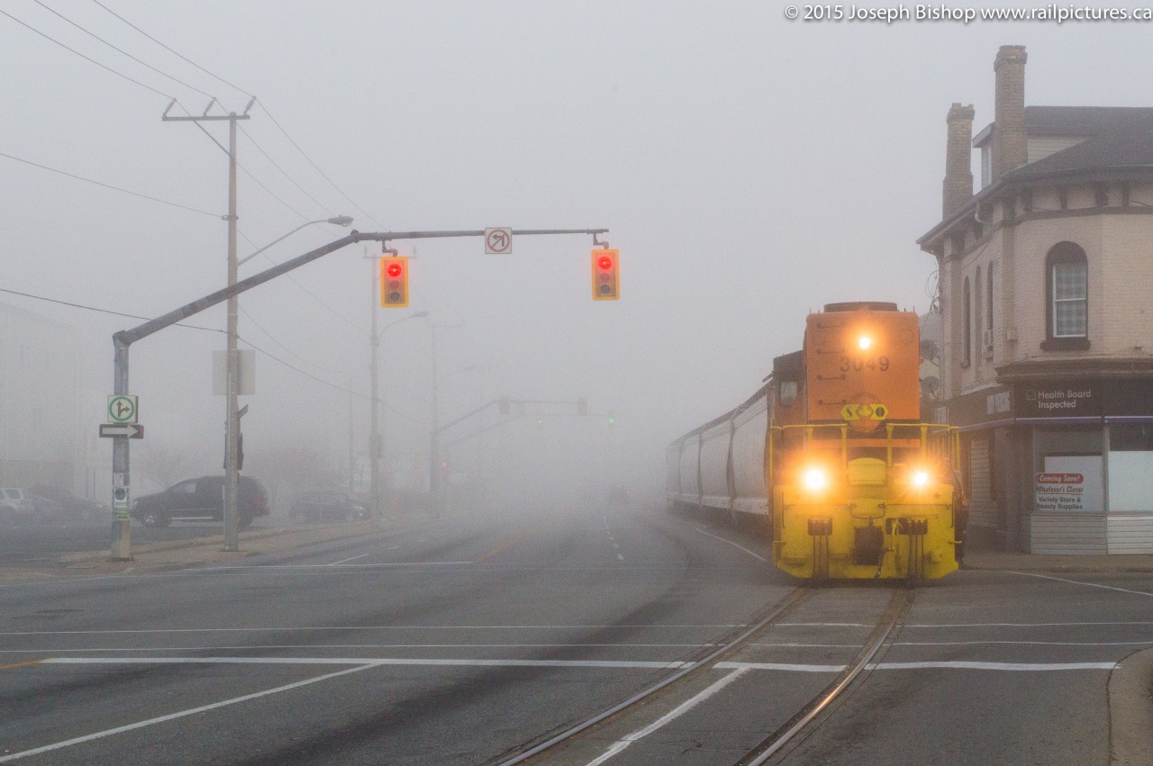 RLHH 3049 emerges from the thick fog that blanketed most of Southern Ontario on November 4, 2015.  With not a car to be seen on the road it made for quite the ominous scene.