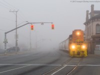 RLHH 3049 emerges from the thick fog that blanketed most of Southern Ontario on November 4, 2015.  With not a car to be seen on the road it made for quite the ominous scene.