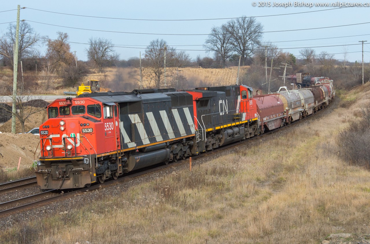CN 331 leans into the curve at Garden Ave with CN 5530 and CN 2616 providing the horsepower today.  The sun came out just in time for the train and complemented the nice and clean SD60F nicely.