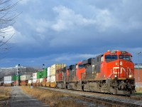 <b>CN 120 around the curve.</b> CN 120 has CN 2816, CN 2319, CN 8873 and CN 3032 mid-train as it heads through St-Henri during a sunny spell.