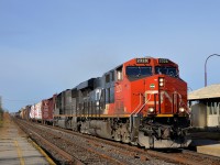 <b>Just before the sun went away.</b> CN 2328 & IC 1036 lead CN 368 through Dorval just before a sunny morning turned into an overcast day. CN 368 would meet its counterpart (CN 369) just east of here, a meet that would usually take place well west of Montreal, but 369 was very late.