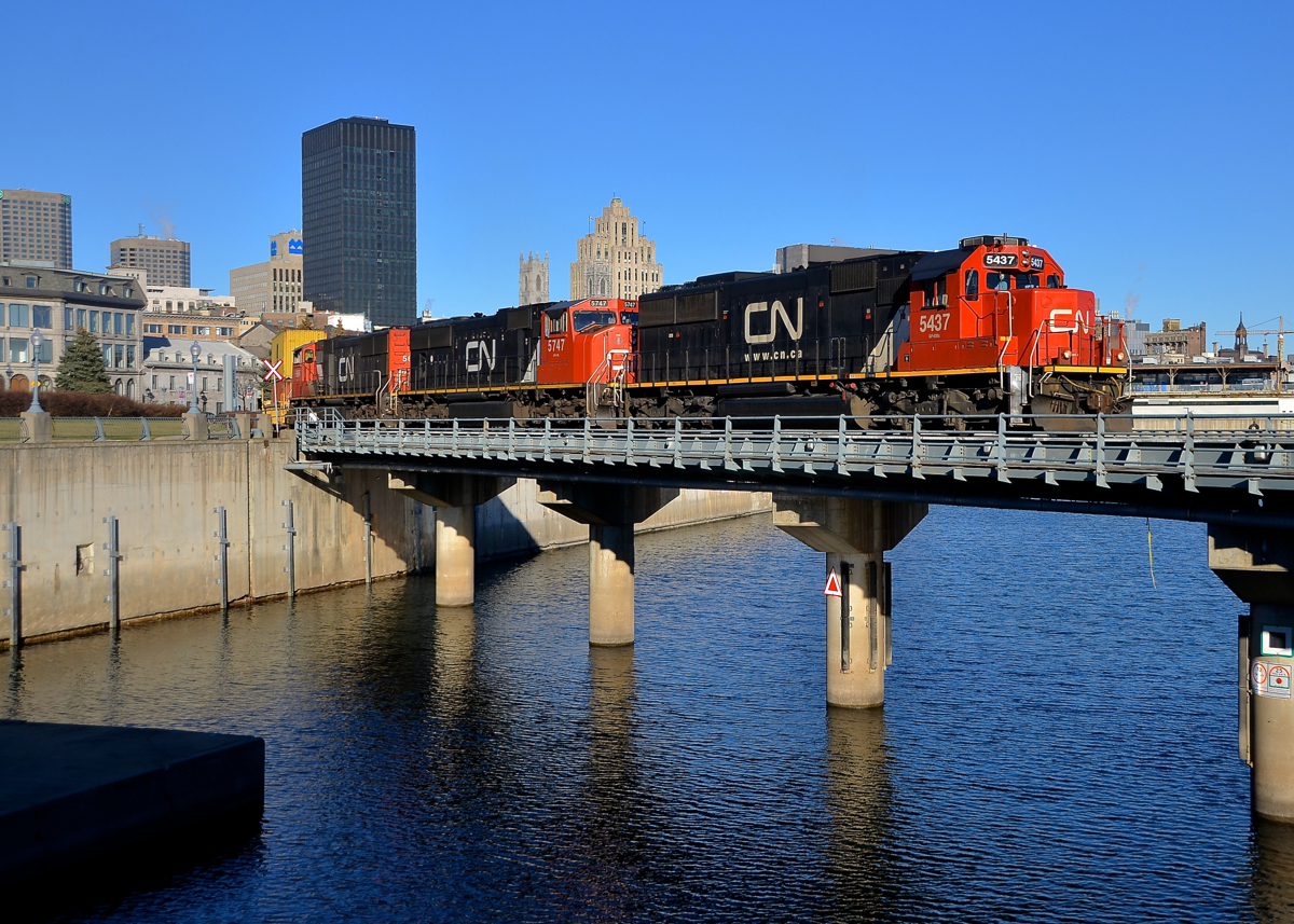 A rare leader these days.... and unwanted by the crew. Most of CN's ex-Oakway SD60's are in storage, so I was very surprised to see one leading CN 149 this morning. Apparently the crew was none too pleased as they ended up wyeing the power at Belleville. Here CN 5437 leads two more EMD's (SD75I's CN 5747 & CN 5666) as CN 149 crosses the Lachine canal on a gorgeous morning.