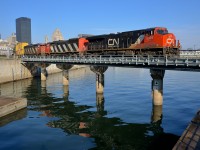 <b>Not quite what I was hoping for.</b> CN 148 was reported as having an ES44DC bracketed by a pair of SD60F's yesterday, which meant that an SD60F would most likely lead CN 149 out of the Port of Montreal the next morning. Unfortunately fume issues with the leader meant that the crew rearranged the lashup to have ES44DC CN 2339 leading. Here CN 149 crosses the Lachine Canal not too long after leaving the Port of Montreal, with a long intermodal train bound for Chicago. Power is CN 2339 with SD60F's CN 5547 & CN 5510 relegated to trailing status.