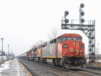 Loaded oil train CN 720 has a Dash8-40CM, Dash9-44CW and a Dash8-40C (CN 2440, BNSF 4869 & CN 2010) as it heads east through Dorval as a bit of snow falls.