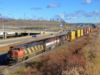 CN 149 has a pair of Dash8 cowls leading a Dash9 (CN 2412, BCOL 4602 & CN 2650) as it approaches the Angrignon overpass.