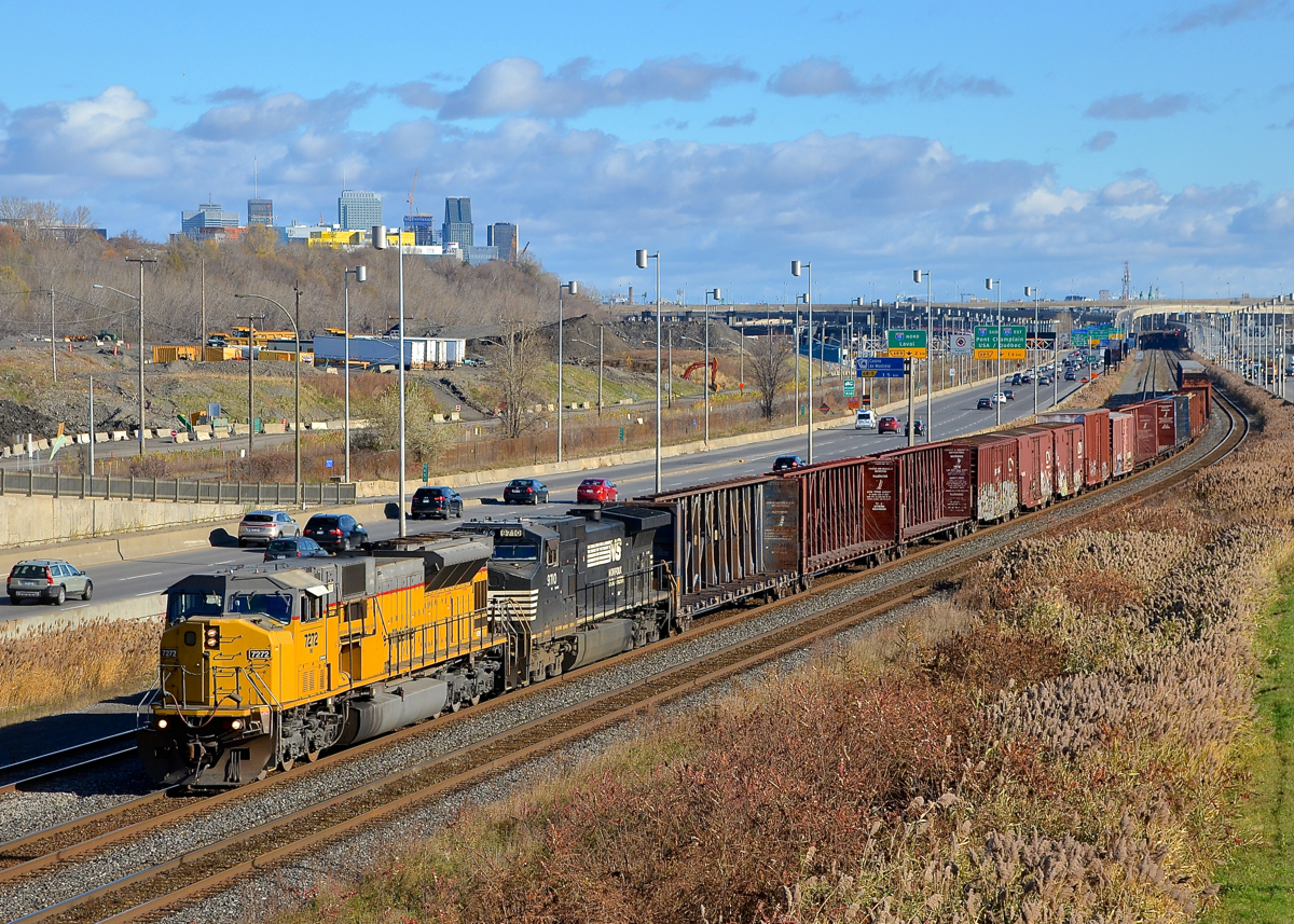 NS 7272, an ex-UP SD9043MAC, is leading CN 529 in Montreal as it approaches the Angrignon overpass. Trailing is NS 9710.