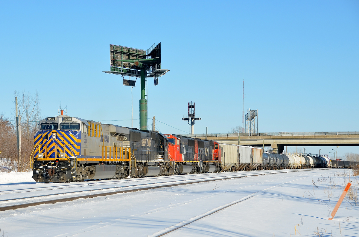 Switching with a CREX leader.  CN 527 is switching at the western end of Southwark Yard in St-Lambert with CREX 1205, NS 2549, CN 5875 & CN 5632. The Citirail and NS unit had entered Montreal on CN 529, an NS run-through train.