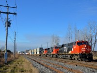 <b>Three GE's, three models, elephant style.</b> ES44AC CN 2912, Dash9-44CW CN 2582 & ES44DC CN 2311 are lashed up elephant style as they lead CN 120 on the St-Hyacinthe sub.